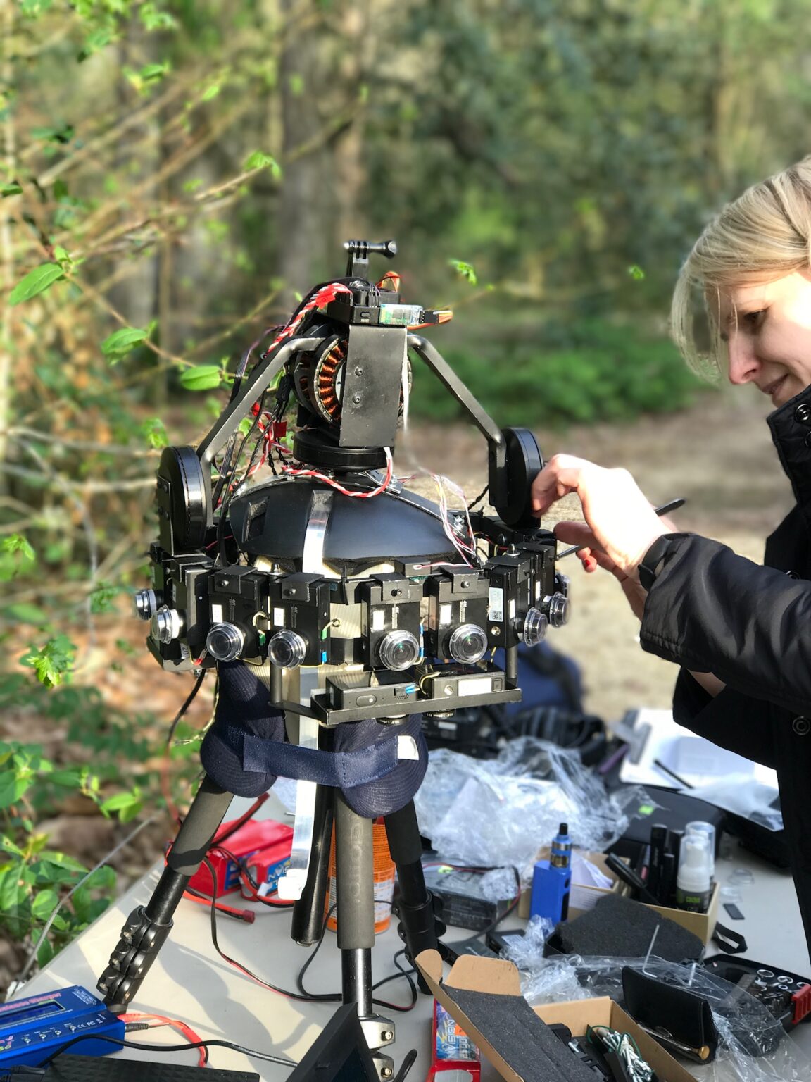 The Emerson custom immersive camera rig mounted on a vehicle, a crew member at its side